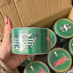 Green Duct Tape with Saskatchewan Roughrider & Pilsner Logo. Comes with coaster